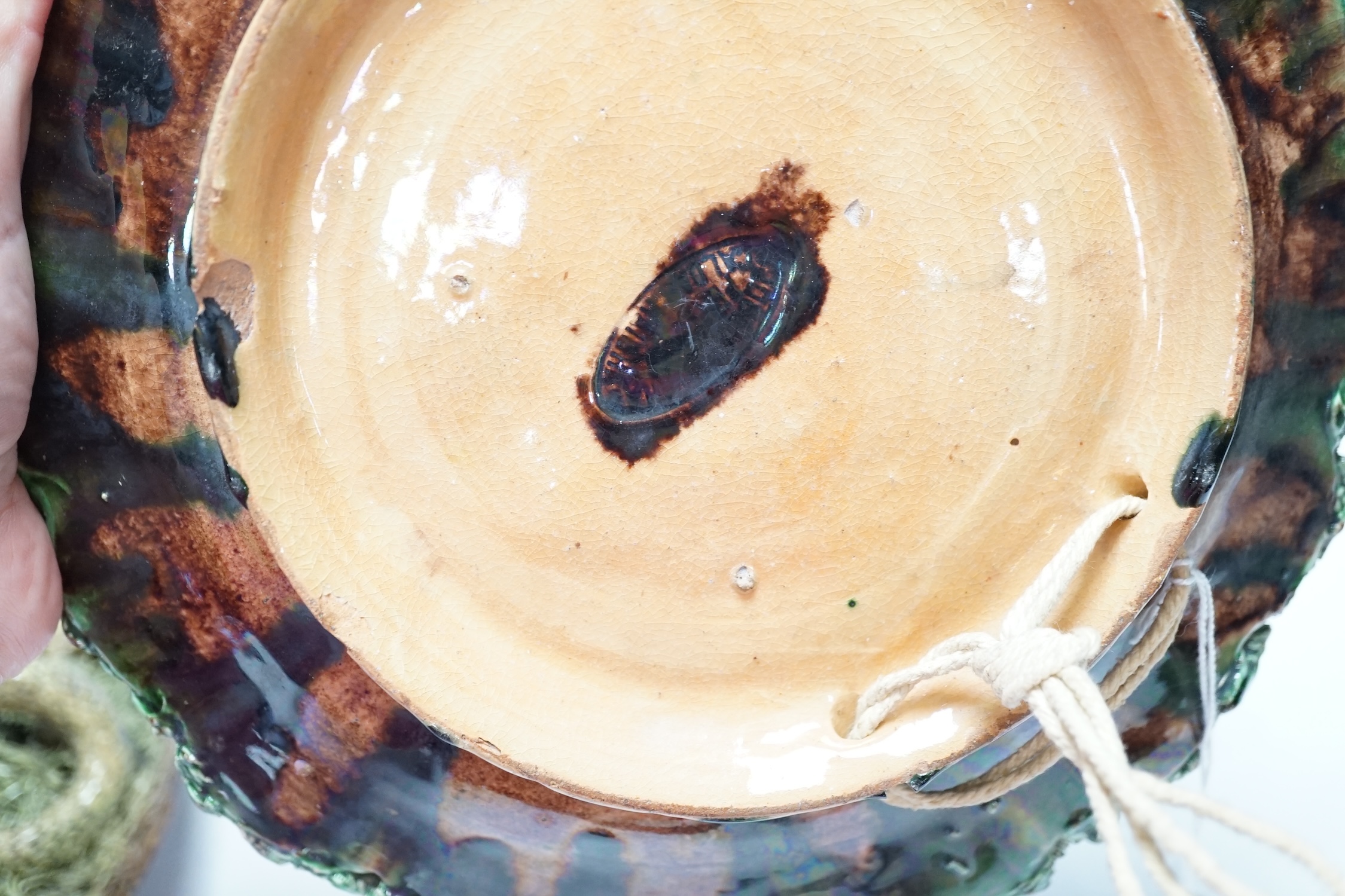 Two Caldas Palissy ware dishes decorated with frogs, snakes and a lizard, the larger 24cm diameter